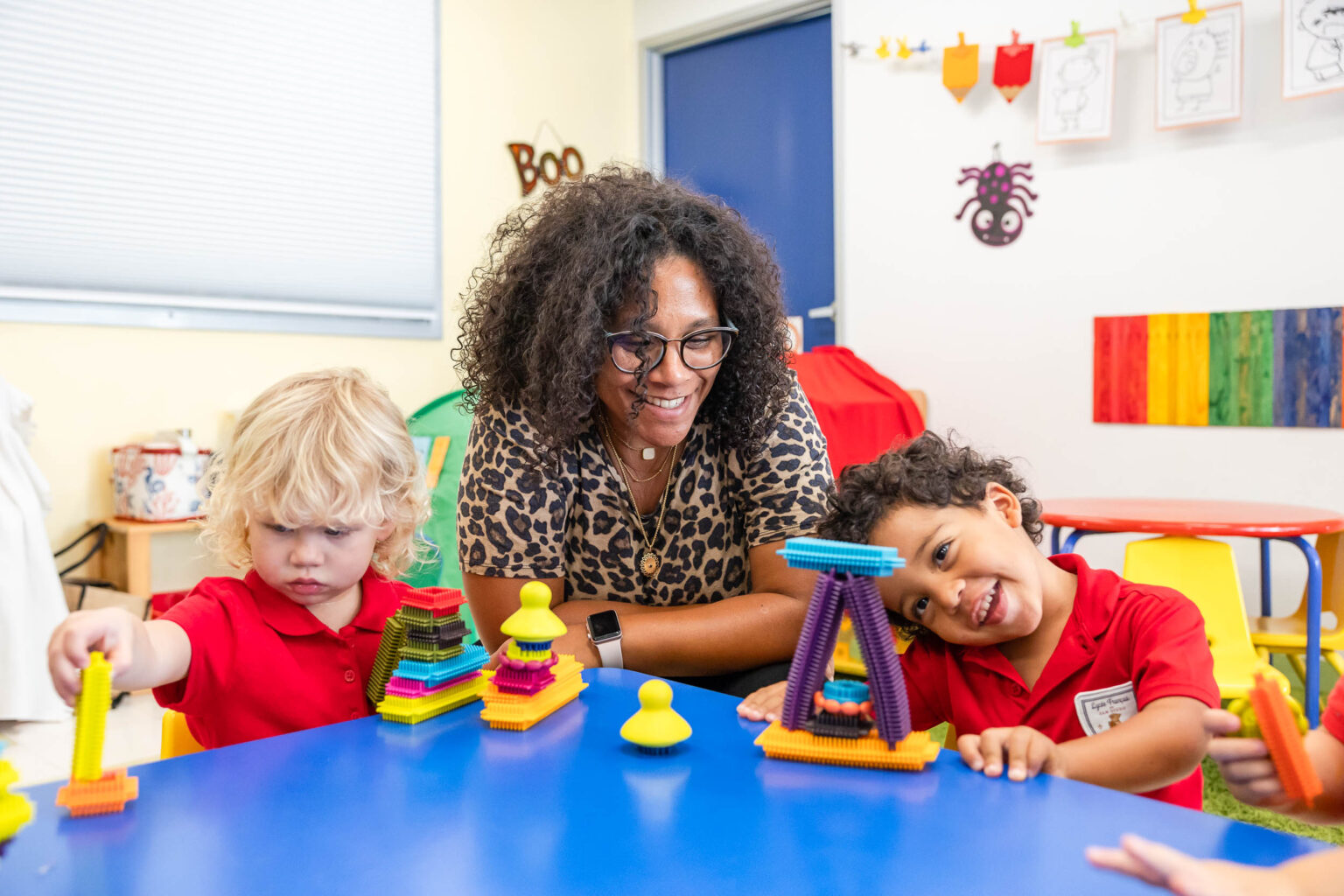 Preschool teacher with young students